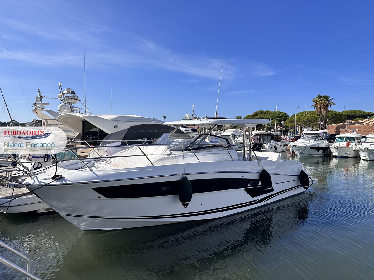 Jeanneau CAP CAMARAT 12.5 WA 2022 Jeanneau CAP CAMARAT 12.5 WA yacht docked in a marina under clear blue skies.
