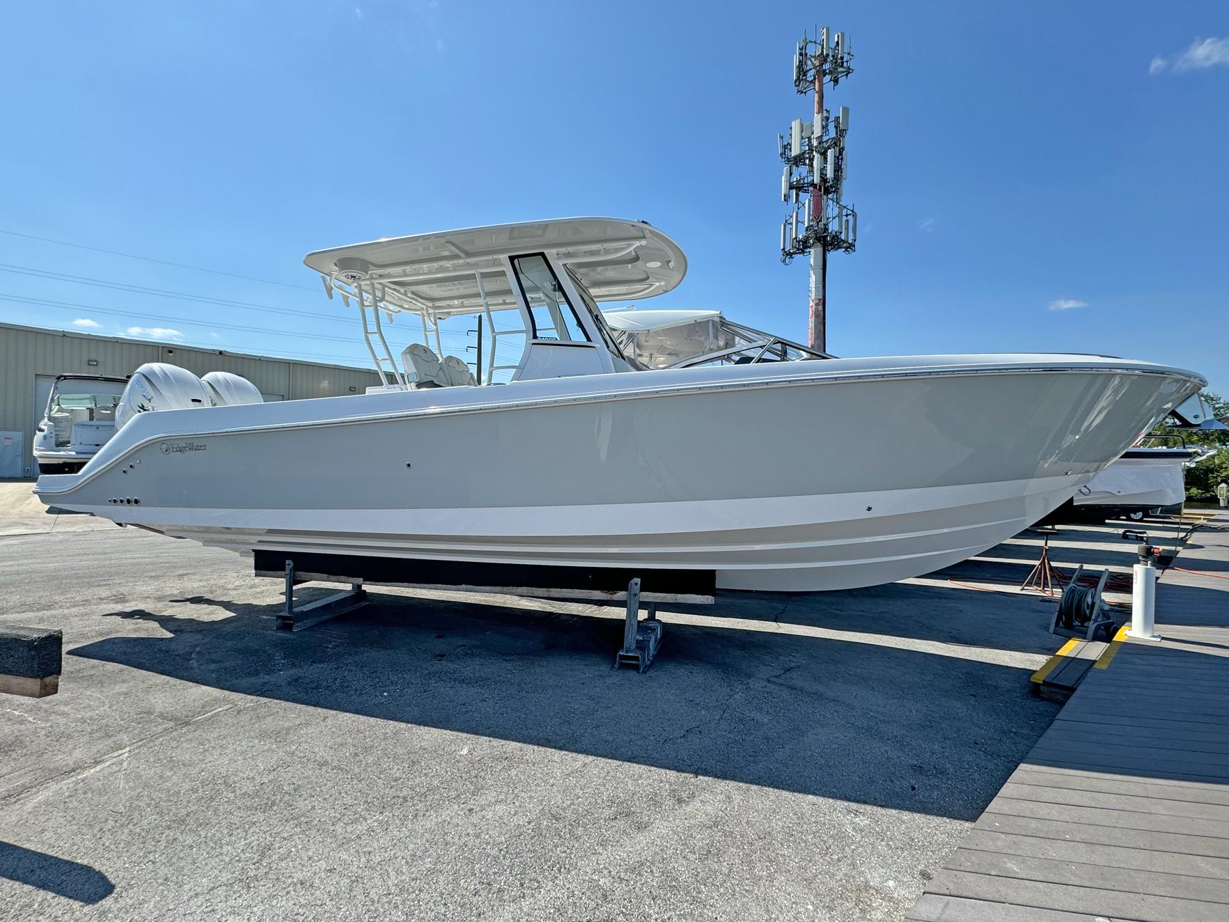 Edgewater 340CC 2025 Edgewater 340CC boat on display, sleek design, clear blue sky background.