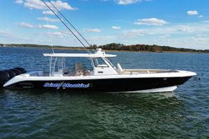 Everglades 435 Center Console 2020 Everglades 435 Center Console boat on water, clear sky background.