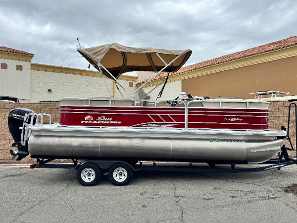 Sun Tracker Party Barge 22 DLX XP3 2021 Sun Tracker Party Barge 22 DLX XP3 pontoon boat with canopy on trailer.