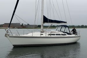 Catalina 36 Sailboat Catalina 36, 1992 model, cruising on calm waters with a person onboard.