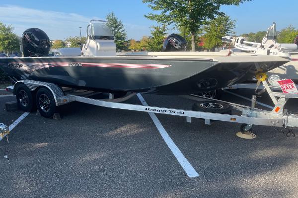 Ranger RB200 2024 Ranger RB200 boat on trailer, parked in lot, for sale sign visible.