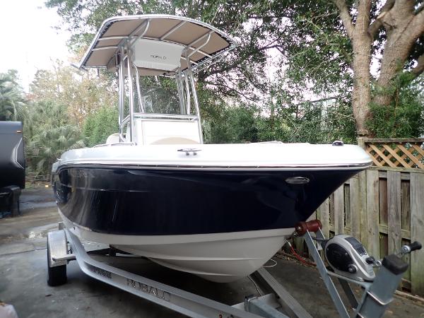 Robalo R180 Center Console 2021 Robalo R180 Center Console boat on trailer, parked outdoors.
