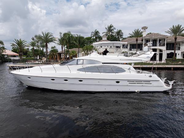 Azimut 58 1999 Azimut 58 yacht on water near luxury waterfront homes.