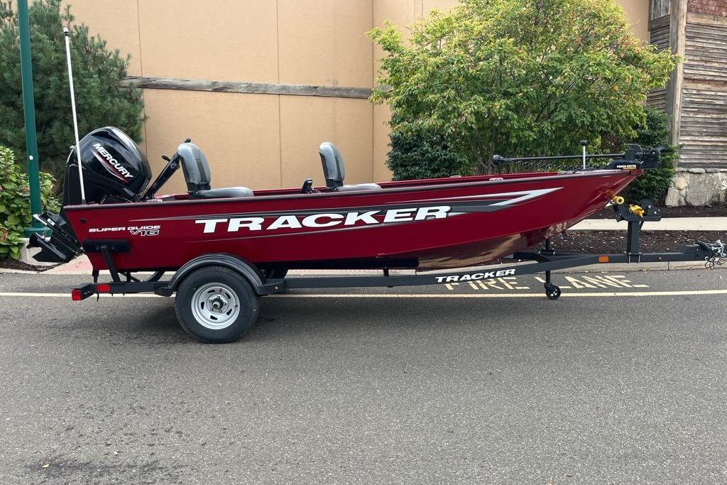 Tracker Super Guide V-16 T 2026 Tracker Super Guide V-16 T boat on trailer, parked outdoors.