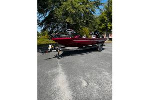 Ranger RT178 2026 Ranger RT178 boat in red, parked on a trailer in a sunny outdoor setting.