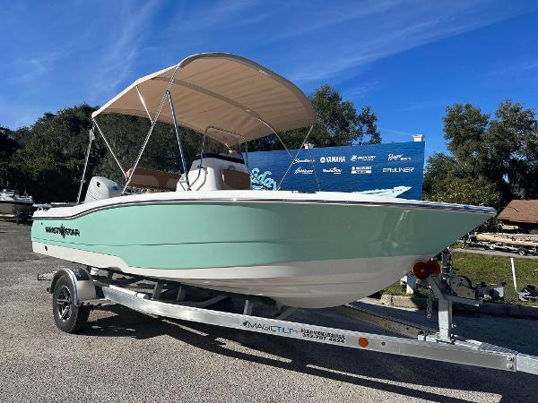 NauticStar 191 Hybrid 2023 NauticStar 191 Hybrid boat on trailer with canopy, mint green hull.