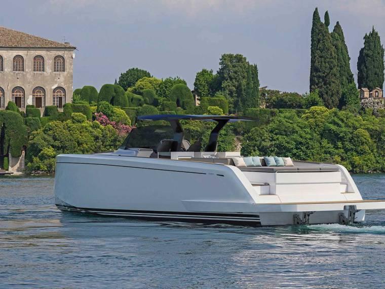 Pardo Yachts 50 2025 Pardo Yachts PARDO 50-MOORING luxury yacht on serene water near lush greenery.