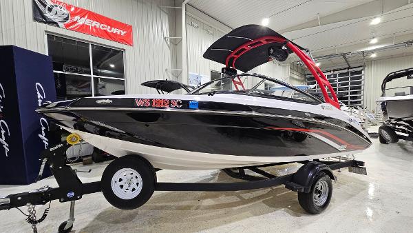 Yamaha Boats AR195 2019 Yamaha AR195 boat in showroom, black and white design, on trailer.