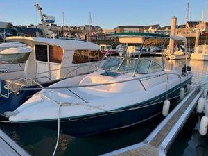 Jeanneau Cap Camarat 725 WA 1998 Jeanneau Cap Camarat 725 WA boat docked in a marina at sunset.