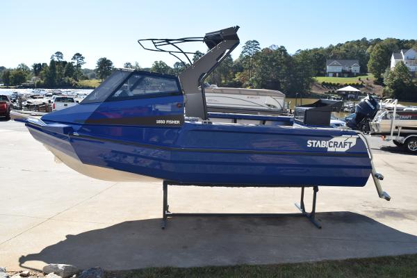 Stabicraft 1850 Fisher Sportfish 2024 Stabicraft 1850 Fisher Sportfish boat in vibrant blue, displayed outdoors.