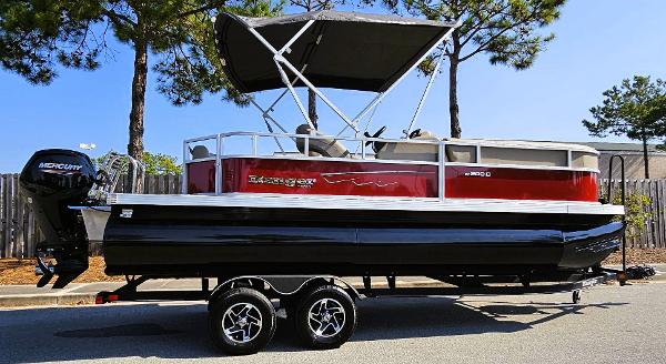 Ranger Reata 200C 2024 Ranger Reata 200C pontoon boat on trailer, parked outdoors.