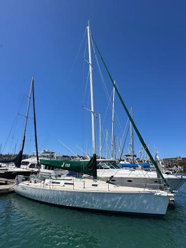 J Boats J/120 1996 J Boats J/120 sailboat docked in marina under clear blue sky.