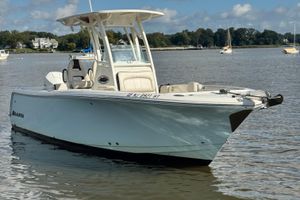 Sailfish 241 CC 2024 Sailfish 241 CC boat on calm water, showcasing sleek design and modern features.