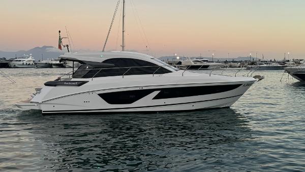 Beneteau Gran Turismo 41 2023 Beneteau Gran Turismo 41 yacht on calm water at sunset.