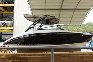 Yamaha Boats 242 Limited S E-Series 2016 Yamaha Boats 242 Limited S E-Series in storage, sleek black and white design.