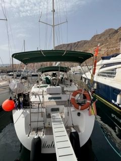 Beneteau Oceanis 44 CC 1997 Beneteau Oceanis 44 CC yacht docked in marina, rear view with green canopy.