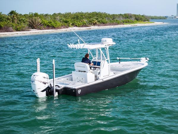 Barker Boatworks 26 Calibogue Bay 2018 Barker Boatworks 26 Calibogue Bay cruising on clear blue water near a lush shoreline.