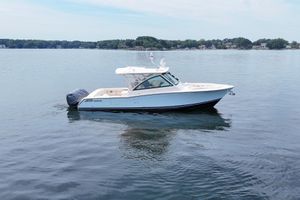 Grady-White Freedom 375 2023 Grady-White Freedom 375 boat on calm lake waters, showcasing sleek design.