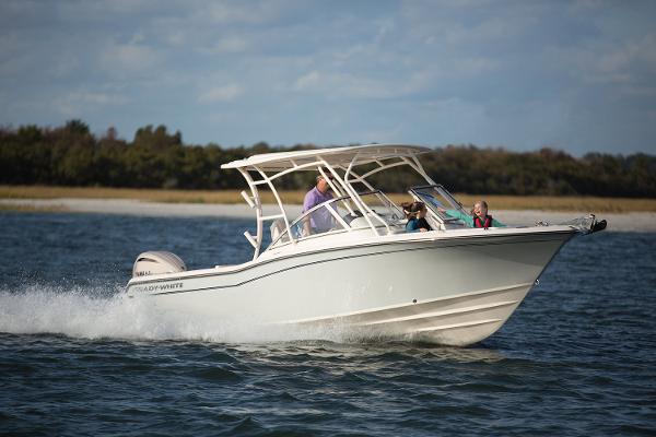Grady-White Freedom 235 2025 Grady-White Freedom 235 boat cruising on water with passengers.