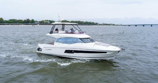 Prestige 460 Flybridge 2023 Prestige 460 Flybridge yacht cruising on open water.