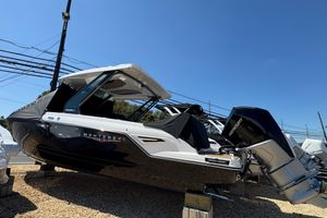 Monterey Elite 30 OB 2026 Monterey Elite 30 OB boat displayed outdoors on a sunny day.