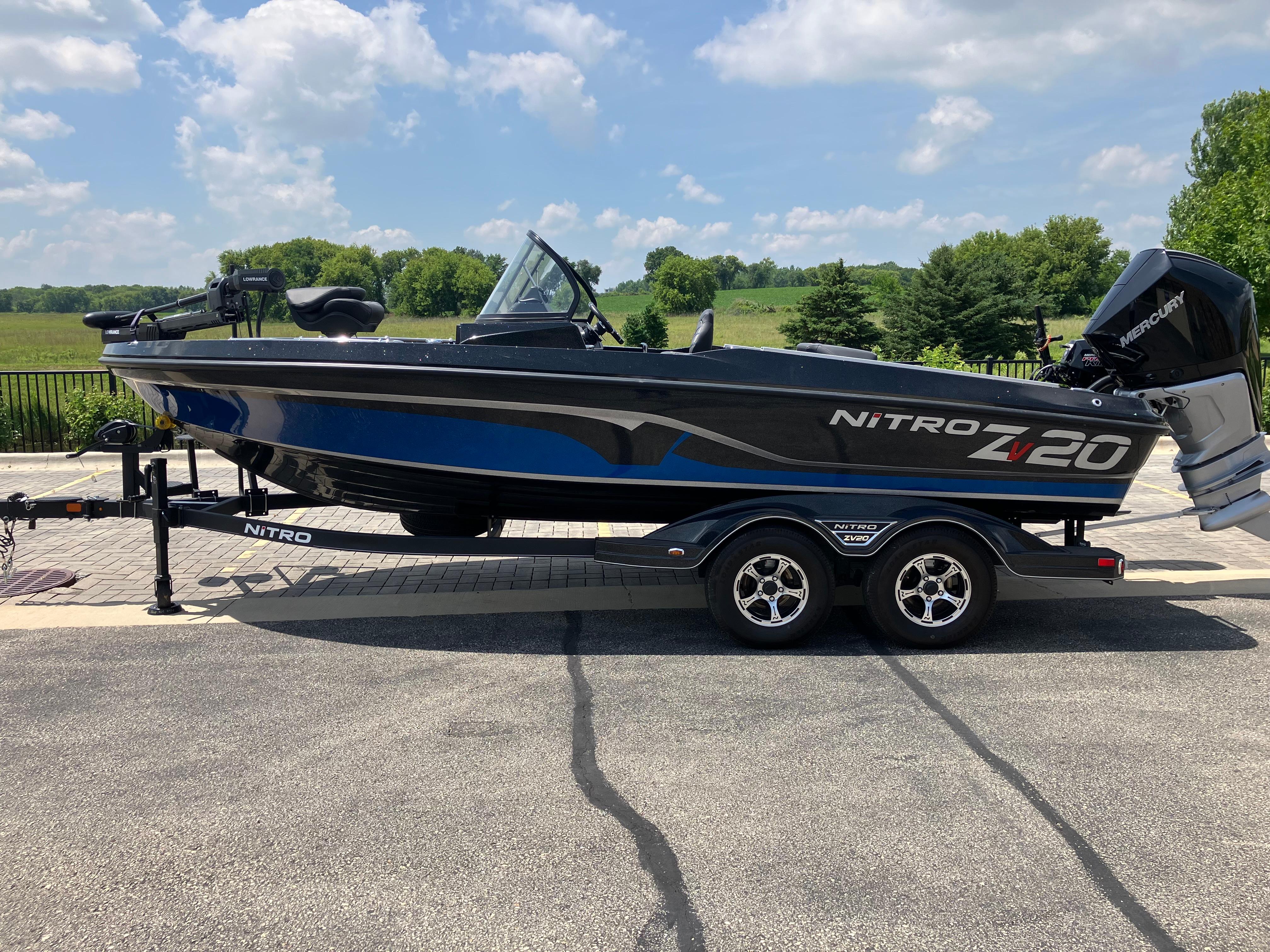 Nitro ZV20 Pro 2024 Nitro ZV20 Pro boat on trailer, parked outdoors under a blue sky.