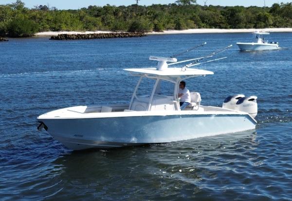 Jupiter 30 FS 2015 Jupiter 30 FS boat cruising on a scenic waterway.