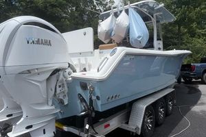 Sea Hunt Gamefish 30 Forward Seating 2022 Sea Hunt Gamefish 30 on trailer with Yamaha outboard motor, parked outdoors.