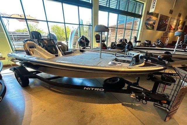 Nitro Z18 Pro 2025 Nitro Z18 Pro fishing boat displayed in showroom with trailer.