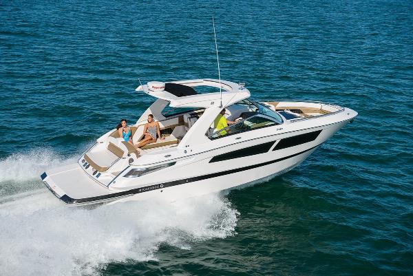 Four Winns H350 2020 Four Winns H350 boat cruising on open water with passengers onboard.