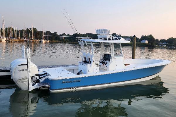 Regulator 30XO Center Console 2023 Regulator 30XO Center Console boat docked on calm water.