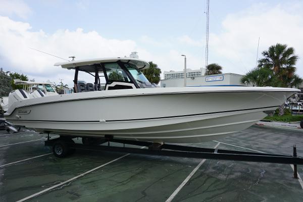 Boston Whaler 380 Outrage 2024 Boston Whaler 380 Outrage boat on trailer in marina.