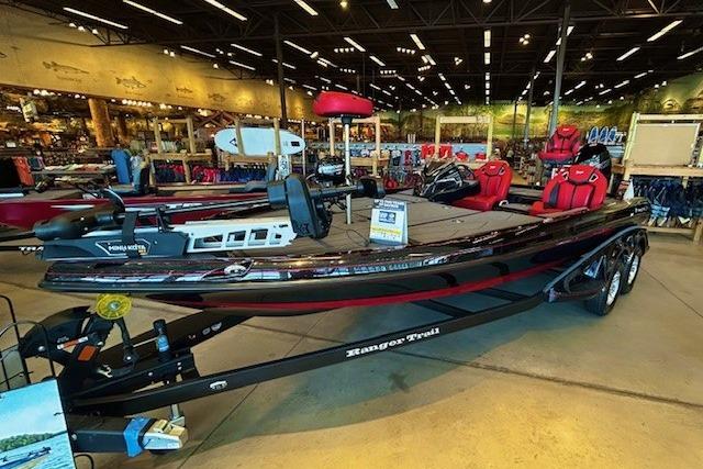 Ranger Z520R 2025 Ranger Z520R boat displayed in a showroom with red seating and modern design.