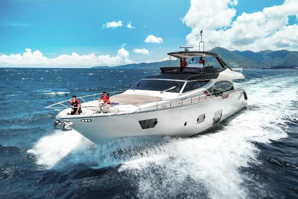 Ferretti Yachts 870 Luxurious 2016 Ferretti Yachts 870 cruising on open sea under clear blue sky.