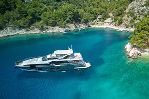 Azimut Grande 27M 2024 Azimut Grande 27M yacht in a serene, turquoise bay with lush greenery.