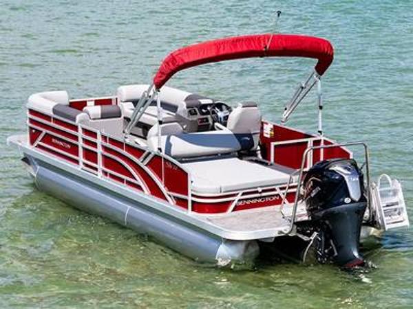 Bennington 22 svsb 2024 Bennington 22 SVSB pontoon boat with red canopy on clear water.