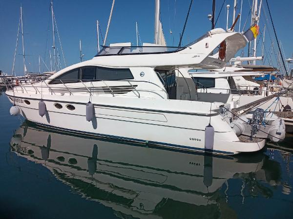 Enterprise Marine EM46 2005 Enterprise Marine EM46 yacht docked in marina, reflecting on calm water.