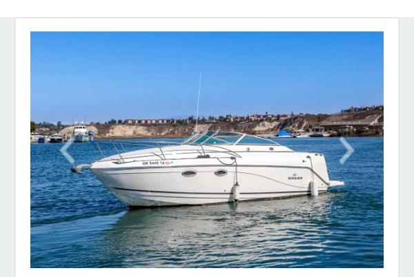 Rinker 270 Express Cruiser 2006 Rinker 270 Express Cruiser on calm water, clear blue sky background.