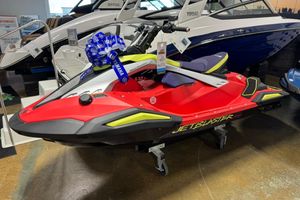 Yamaha WaveRunner JetBlaster PRO 2-Up 2026 Yamaha WaveRunner JetBlaster PRO 2-Up in showroom, vibrant red and yellow design.