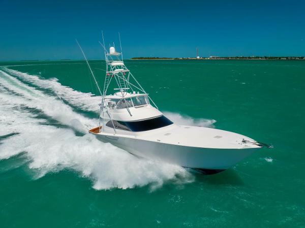 Viking 70 Convertible Viking 70 Convertible 2011 yacht cruising on turquoise waters under clear blue skies.