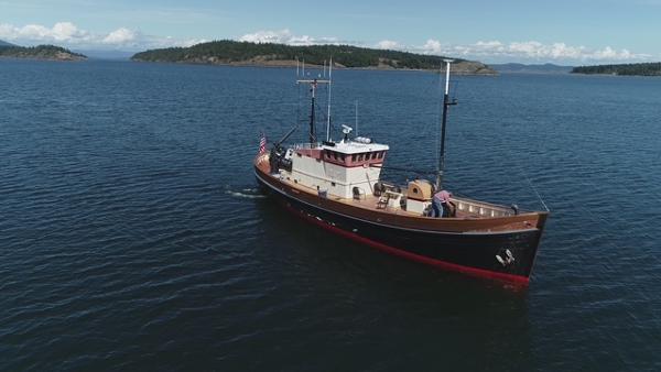 Custom North Sea Trawler Vintage 1956 Custom North Sea Trawler sailing on calm waters.