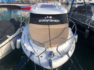 Starfisher 650 OBS Starfisher 650 OBS 2013 boat docked at marina, featuring sleek design and comfortable seating.