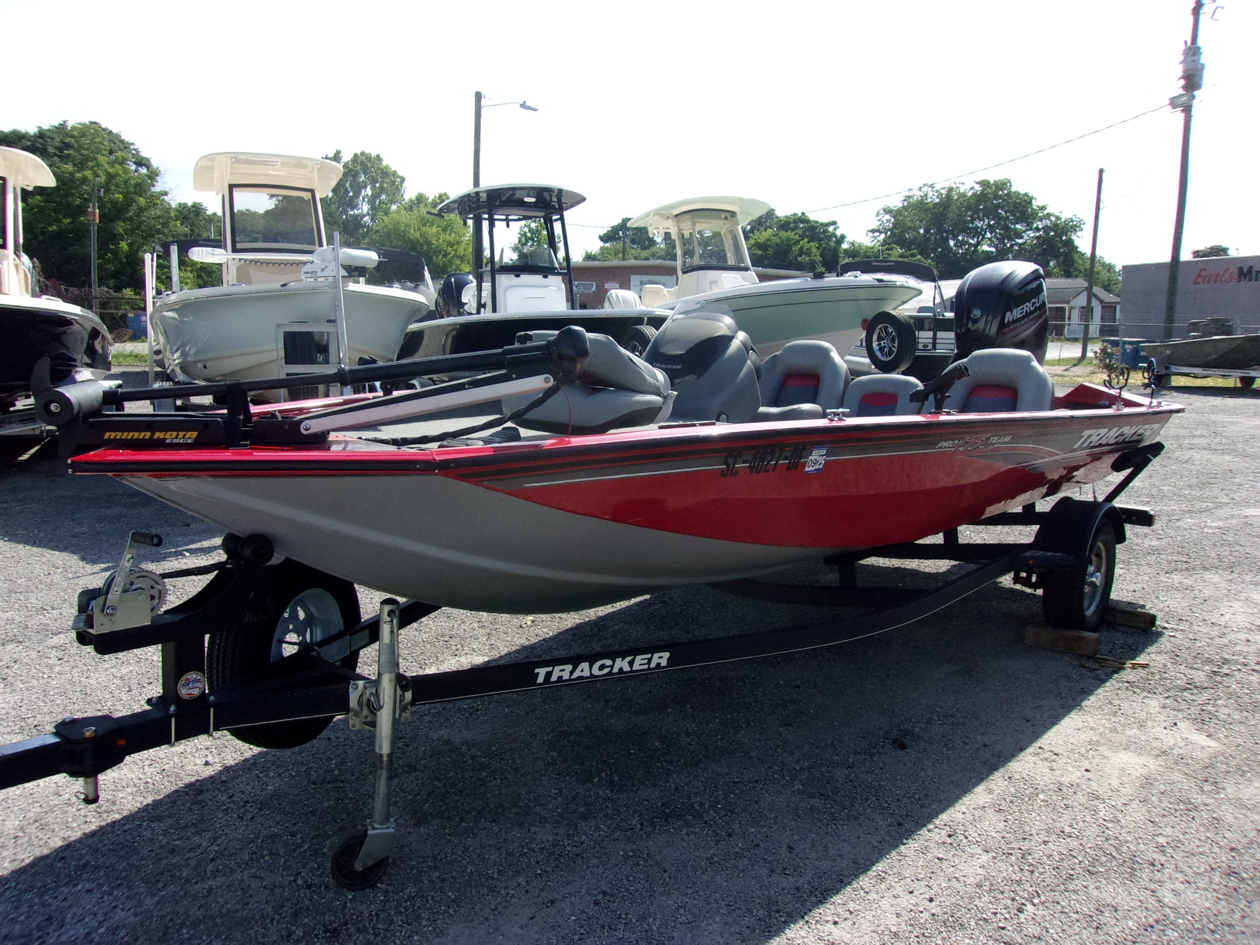 Tracker Pro Team 175 TF 2017 Tracker Pro Team 175 TF boat on trailer, parked outdoors.