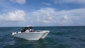 Sedna 370 Open 2024 Sedna 370 Open boat cruising on open sea under blue sky.