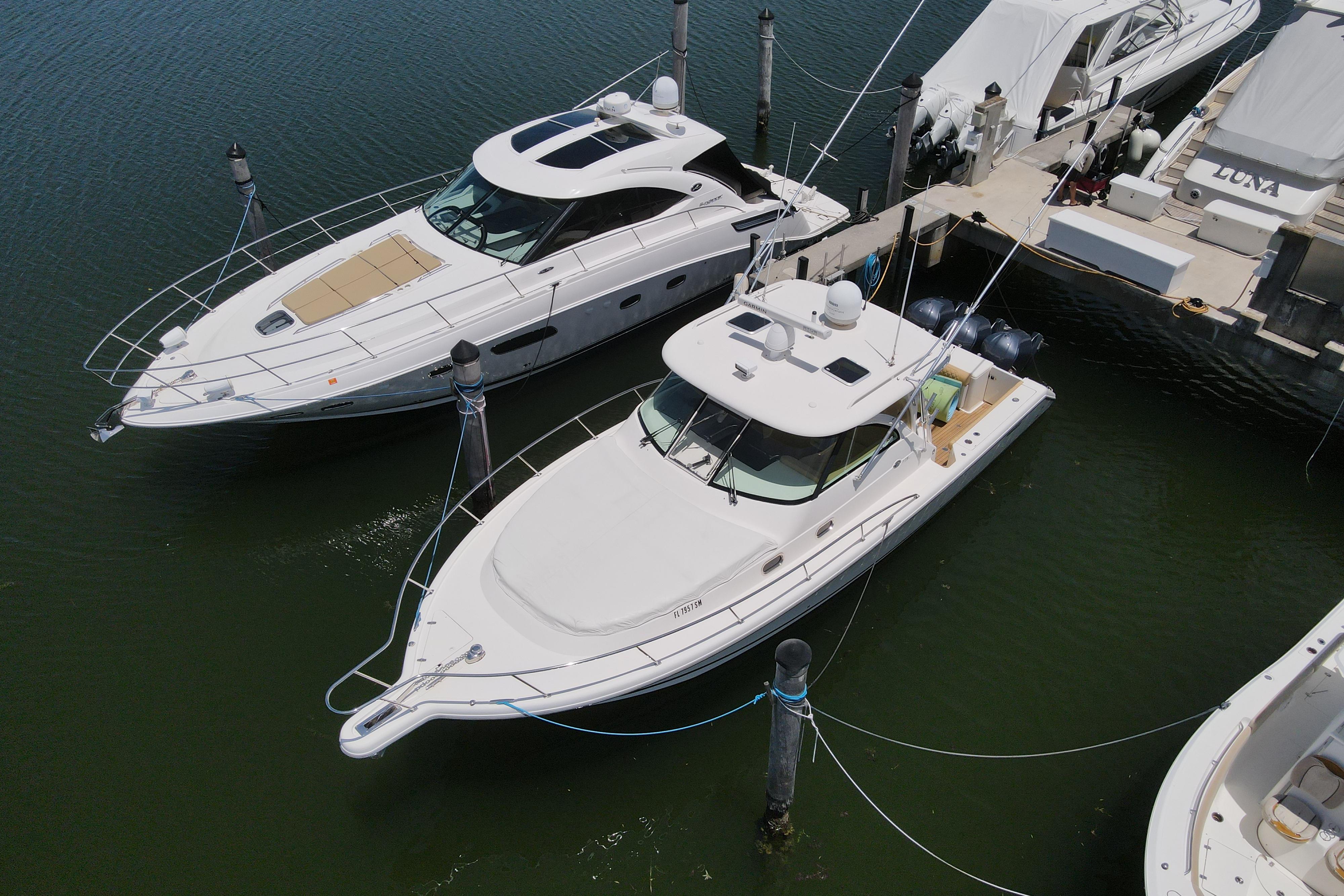 Pursuit OS 375 Offshore 2010 Pursuit OS 375 Offshore docked alongside other boats in a marina.