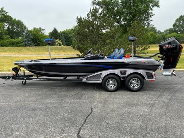 Ranger Z520R 2023 Ranger Z520R bass boat on trailer, parked outdoors.