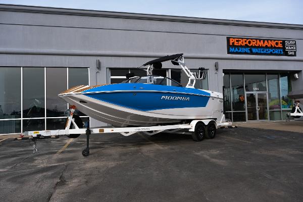 Moomba Mojo 2025 Moomba Mojo boat on trailer outside Performance Marine Watersports store.