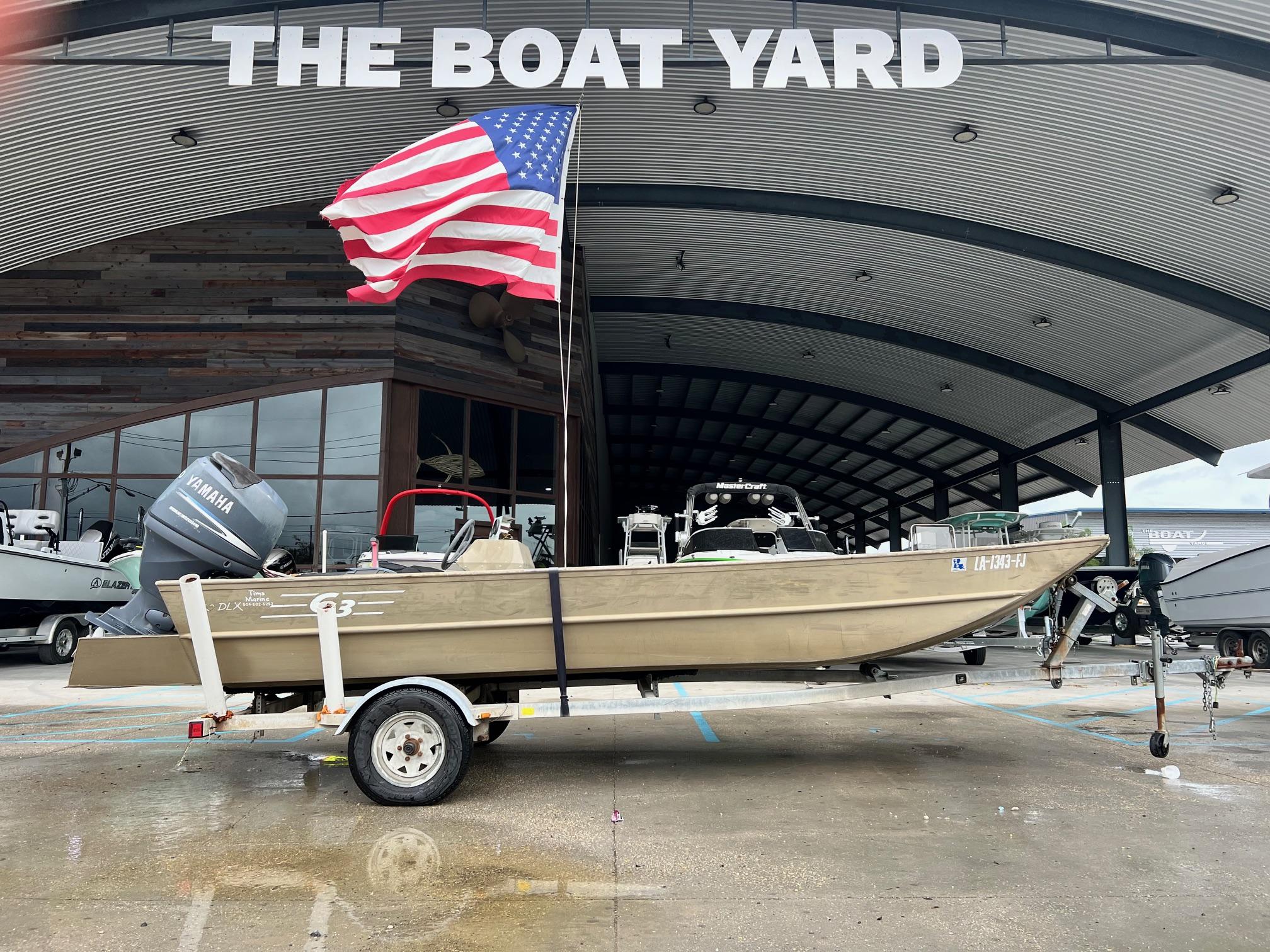 G3 1860 DLX 2002 G3 1860 DLX boat with American flag at The Boat Yard.