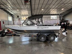 Duckworth 18 Advantage 2026 Duckworth 18 Advantage boat on trailer in a spacious indoor facility.